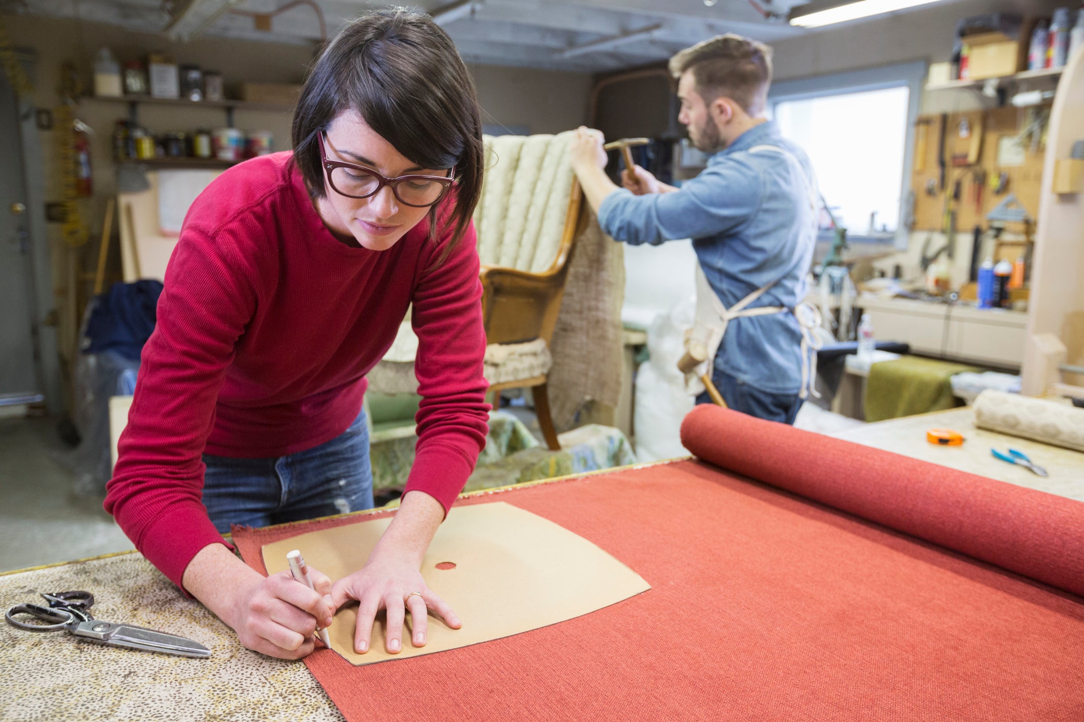 Business owners reupholstering furniture