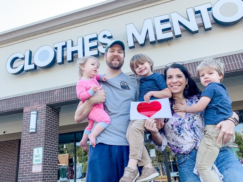 family in front of Clothes Mentor storefront